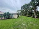 Side yard view of home showing lush green grass at 2815 N Leavitt Ave, Orange City, FL 32763