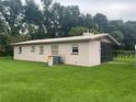 Back exterior view of home with AC unit at 2815 N Leavitt Ave, Orange City, FL 32763