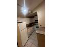 Kitchen with white appliances, granite countertops, and a breakfast bar at 6312 Raleigh St # 513, Orlando, FL 32835