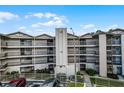 Exterior view of a multi-story building with parking at 1052 Lotus Cove Ct # 743, Altamonte Springs, FL 32714