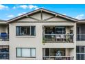 Apartment balcony with lake view and patio furniture at 1052 Lotus Cove Ct # 743, Altamonte Springs, FL 32714