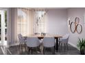 Modern dining room featuring a live-edge table and gray chairs at 209 N Pine Ave, Oviedo, FL 32765