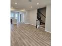 Spacious living room with hardwood floors and an open concept layout at 14315 Sapelo Beach Dr, Orlando, FL 32827