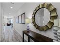 Bright entryway with tile flooring and a large mirror at 1638 Moon Valley Dr, Davenport, FL 33896