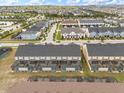 Aerial view of townhomes with private pools and lush landscaping at 2163 Copper Bell Pl, Kissimmee, FL 34747