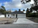 Newly constructed home with a modern facade and a two-car garage at 282 Kimble Ave, Oviedo, FL 32765