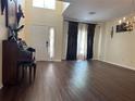 Bright living room with hardwood floors and large windows at 3635 Daydream Pl, Saint Cloud, FL 34772