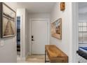 Light and airy entryway with a console table and contemporary artwork at 10544 Wyndcliff Dr, Orlando, FL 32817