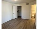 Spacious bedroom with wood-look floors and ample closet space at 4105 Tropical Isle Blvd # 238, Kissimmee, FL 34741