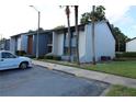 Two-story building exterior with landscaping and parking at 8 Escondido Cir # 79, Altamonte Springs, FL 32701