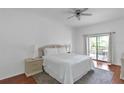Bright bedroom with king-size bed and access to balcony at 9055 Treasure Trove Ln # 206, Kissimmee, FL 34747