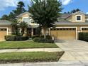 Two story townhome with double garage and neatly landscaped yard at 452 Harbor Winds Ct, Winter Springs, FL 32708
