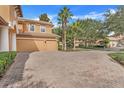 Brick driveway and two car garage of two story house at 9106 Panzani Pl, Windermere, FL 34786