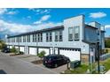 Modern building exterior with multiple units and garages at 2120 Broome St, Kissimmee, FL 34743