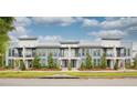 Modern townhome community with attractive landscaping at 2120 Broome St, Kissimmee, FL 34743