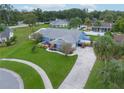 Housetop view of home showing driveway and yard at 8692 Vesta Ter, Orlando, FL 32825