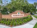 Attractive brick entrance sign for North Cove community with landscaping at 1469 Grace Lake Cir, Longwood, FL 32750