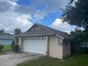 Attached two-car garage with a newly installed roof at 2391 Moonstone Ave, Deltona, FL 32738