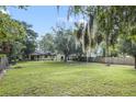 House with large backyard and surrounding trees at 5625 Chipola Cir, Orlando, FL 32839