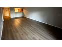 Bright living room with hardwood floors and access to a balcony at 317 Scottsdale Sq # 317, Winter Park, FL 32792