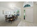 Elegant dining room featuring a large table, hardwood floors, and an abundance of natural light at 812 Shell Ln, Longwood, FL 32750