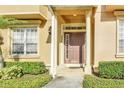 Inviting entrance to a light yellow townhouse at 655 Pensacola Ln, Lake Mary, FL 32746