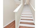 Interior view of a clean, modern staircase at 655 Pensacola Ln, Lake Mary, FL 32746