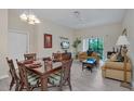 Combined living and dining area with hardwood floors and balcony access at 514 Lucaya Loop # 514, Davenport, FL 33897