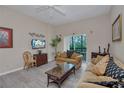 Living room with sofa, coffee table, and balcony view at 514 Lucaya Loop # 514, Davenport, FL 33897