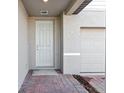 Front entryway with white door and brick walkway at 2462 Leeds St, Haines City, FL 33844