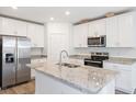 Modern kitchen with stainless steel appliances and island at 2342 White Tail St, Davenport, FL 33837