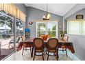 Dining room with table, chairs, and view of backyard at 2713 Chatham Cir, Kissimmee, FL 34746