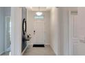 Bright and airy entryway with a modern design at 2419 Greenwood Oak Dr, Apopka, FL 32703