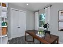 Spacious home office with built-in shelving and a large window at 3087 Norcott Dr, Davenport, FL 33837