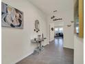 Bright and spacious foyer with mirror and console table at 7876 Oak Reflection Loop, Davenport, FL 33837
