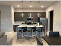 Modern kitchen with island, stainless steel appliances at 7740 Sandy Ridge Dr # 135, Kissimmee, FL 34747