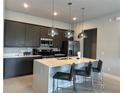 Modern kitchen with island, stainless steel appliances at 7740 Sandy Ridge Dr # 135, Kissimmee, FL 34747