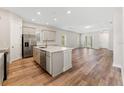 Open kitchen with island, stainless steel appliances at 14663 Englert Aly, Orlando, FL 32827
