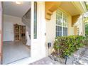 Inviting front entrance with a glass door and well-maintained landscaping at 6316 Miramonte Dr # 106, Orlando, FL 32835