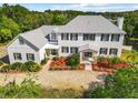 Two story house with a landscaped yard and lake view at 226 Mitnik Dr, Deltona, FL 32738