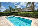Inviting rectangular pool with a spa and brick patio at 420 Lasso Dr, Kissimmee, FL 34747
