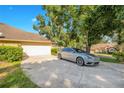 Home's exterior showcasing a driveway and garage at 1434 Hidden Meadow Way, Apopka, FL 32712