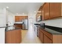 Kitchen with stainless steel appliances and granite countertops at 8039 Northlake Pkwy, Orlando, FL 32827