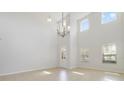 Bright living room with high ceilings and tile floors at 8039 Northlake Pkwy, Orlando, FL 32827