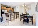 Kitchen with stainless steel appliances and breakfast bar at 8967 California Palm Rd, Kissimmee, FL 34747