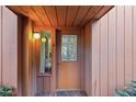 Front entry with decorative glass door and sidelight at 105 Oaks Ct, Sanford, FL 32771