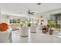 Bright living room with white tile floors and mirrored walls at 899 Jonathan Way # 899, Altamonte Springs, FL 32701