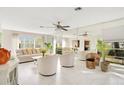 Bright living room with white tile floors and mirrored walls at 899 Jonathan Way # 899, Altamonte Springs, FL 32701