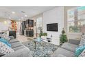 Open living area with comfortable seating and TV at 4738 Terrasonesta Dr, Davenport, FL 33837