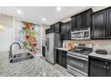 Modern kitchen with stainless steel appliances at 4738 Terrasonesta Dr, Davenport, FL 33837
